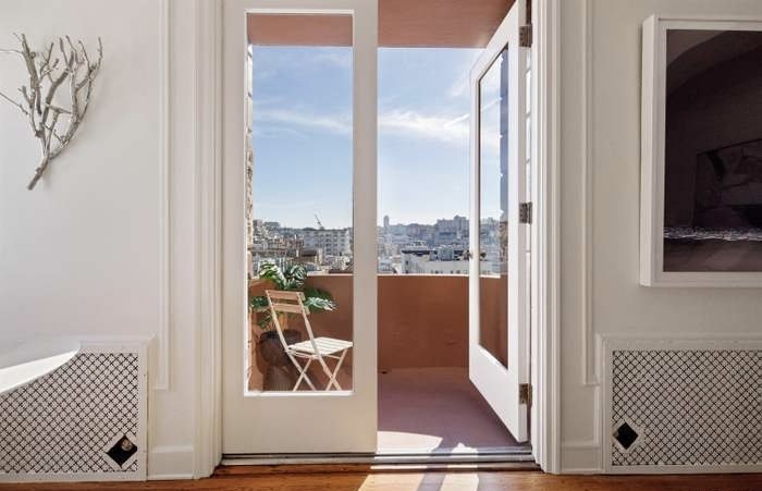 Balcony doorway with city view in an investment property